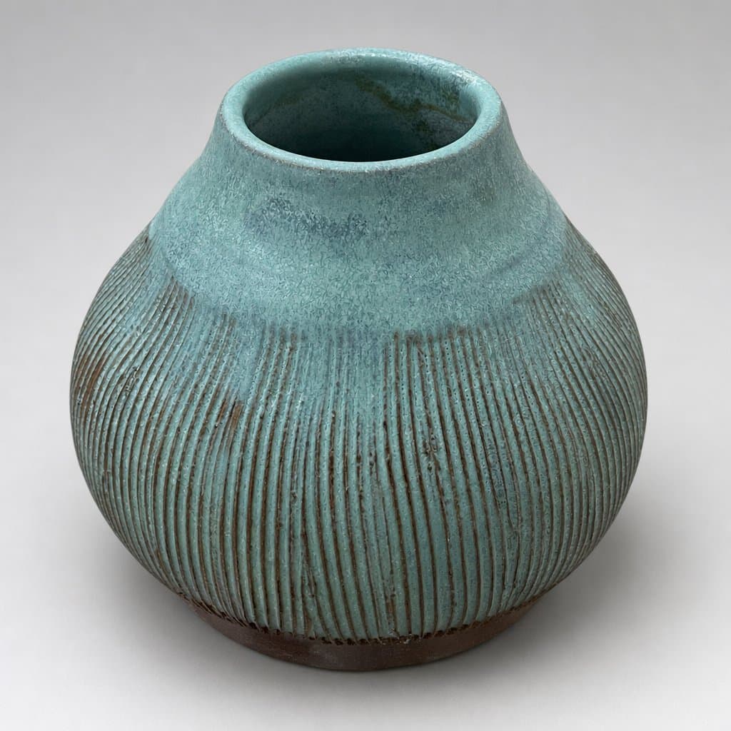 Textured, terracotta vase in seafoam